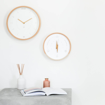 Duo horloge dune et baromètre écru et beige sur un mur