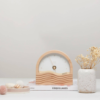 wooden thermometer and personalised ecru and beige dial placed on a book